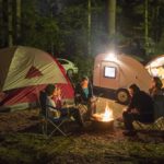 family camping out in the woods