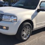 man parking his lincoln navigator