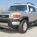 man parking his toyota fj cruiser