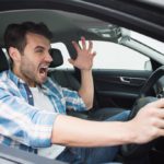 man shouting angrily while on the road