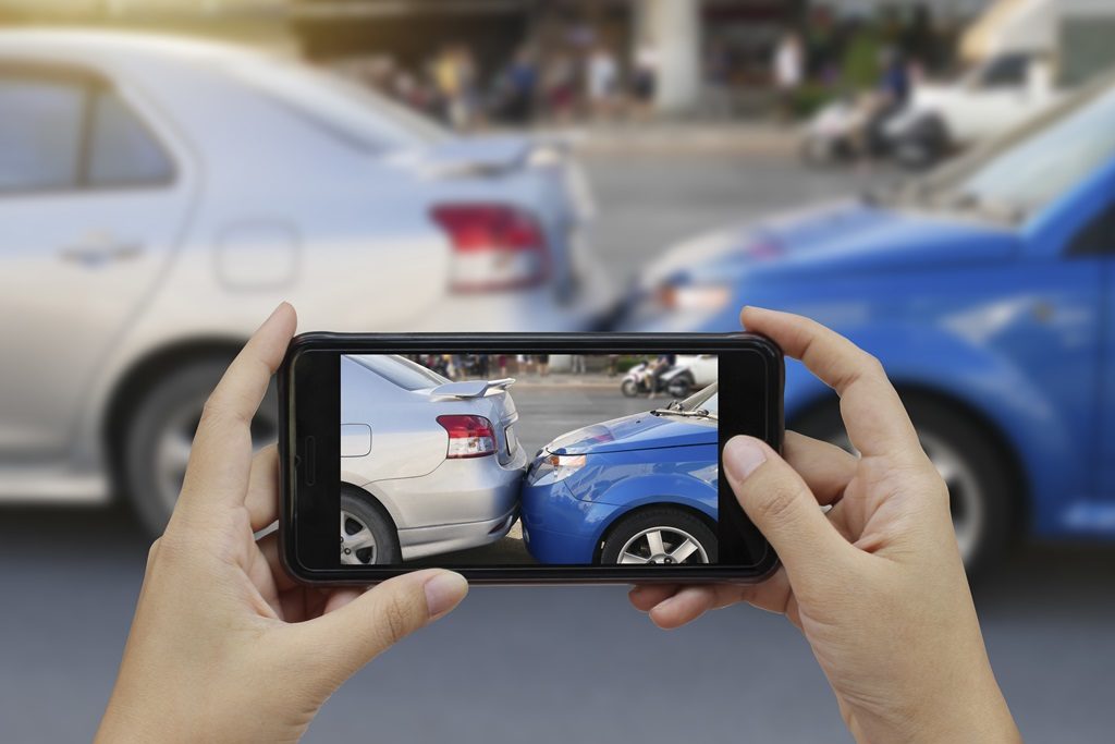 taking a picture of a car accident