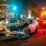 police inspecting the area of the car accident