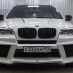 bmw x6 m parked in a garage