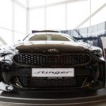 kia stinger on display in a car show