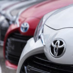 toyota cars lined up in parking lot