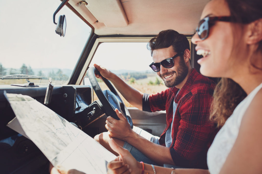 couple reading map in the car