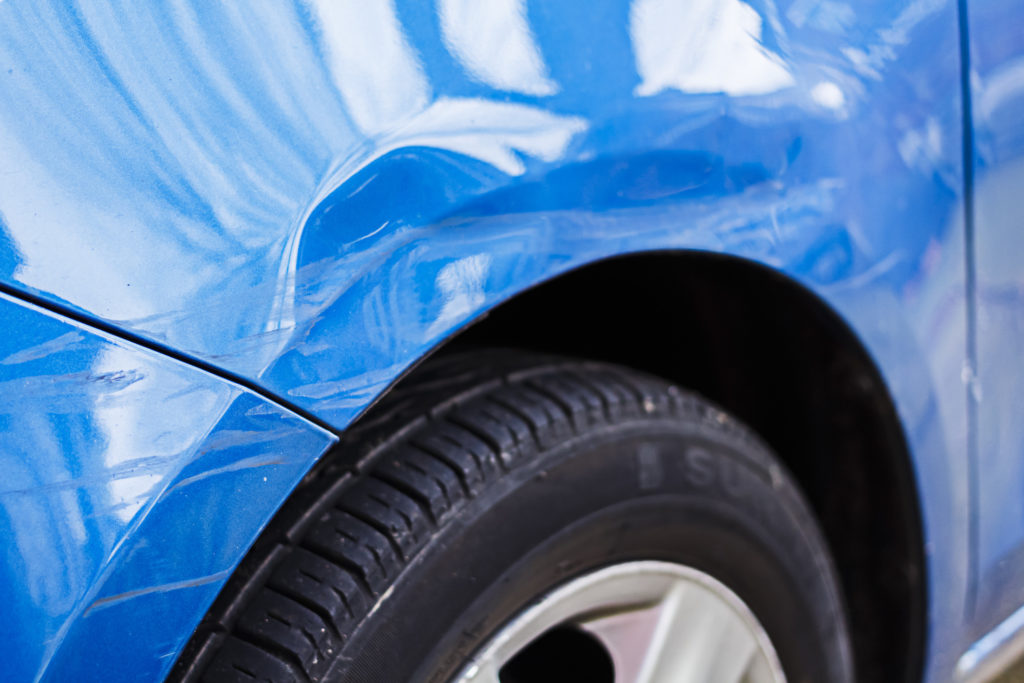 dent on a fender that can be fixed if you spend your tax refund on body repair