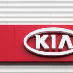 kia logo on dealerhsip wall