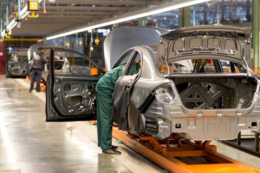 Man working in car plant