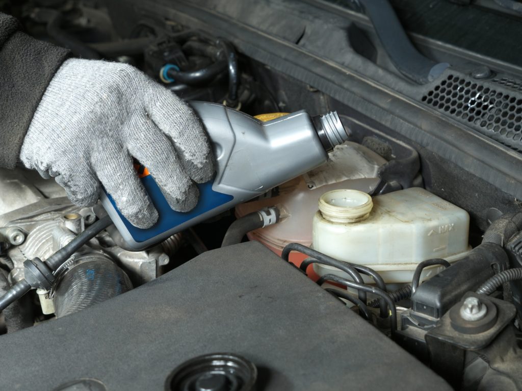 topping up a car's brake fluid