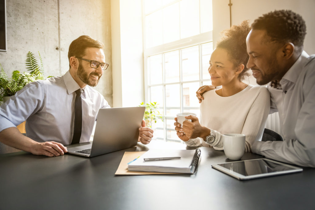 couple consulting an insurance agent