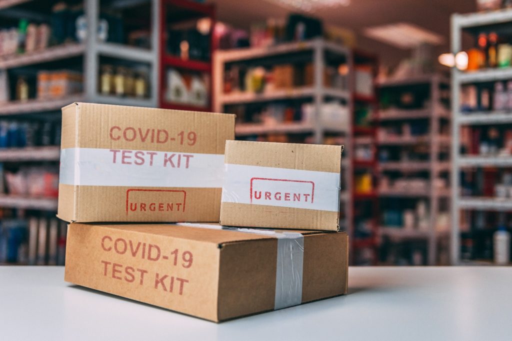 Coronavirus test kits on a shelf