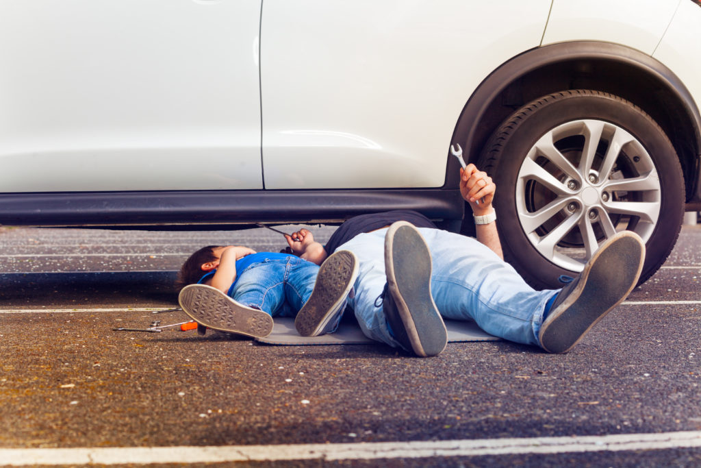 Father and son working under Mom's car together