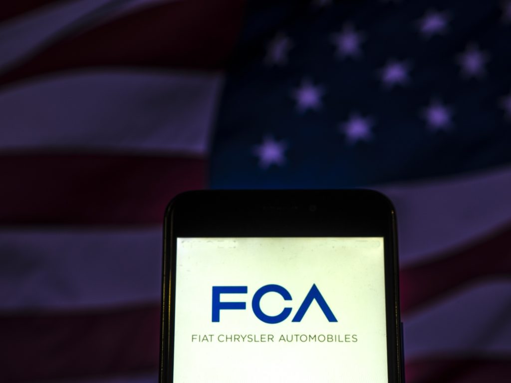 FCA logo against USA flag