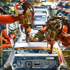 machines in car plant assembling cars