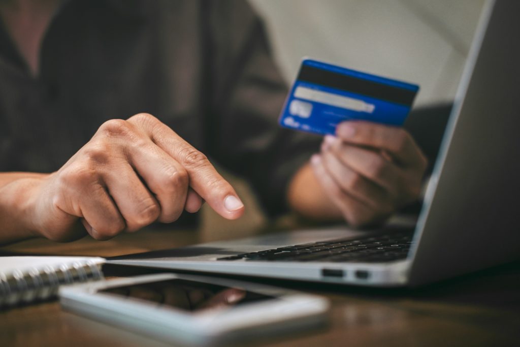 Man shopping online using credit card