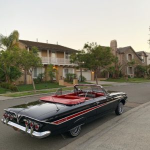 Doing It To Death, Xavier The X-Man's 1961 Chevrolet Impala Convertible, parked on a residential street