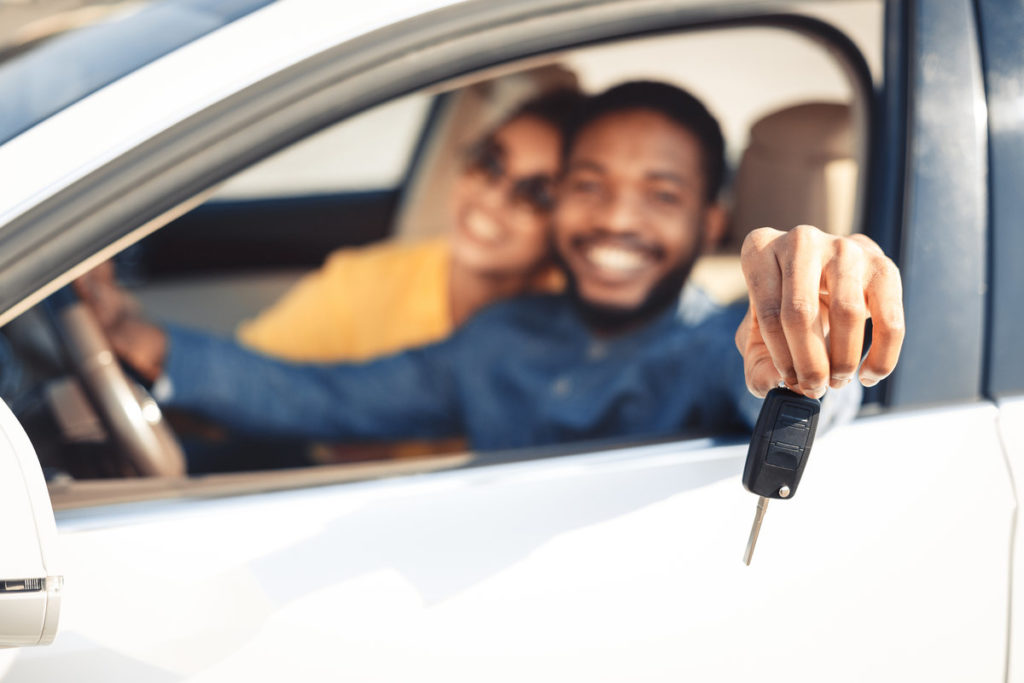 couple buys new car