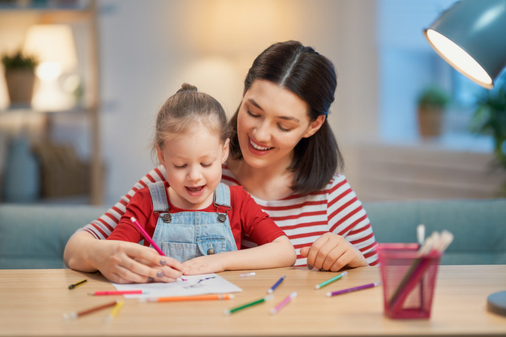 mother and daughter writing letters to servicemen