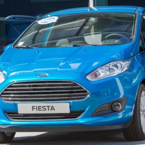 blue ford fiesta displayed in showroom