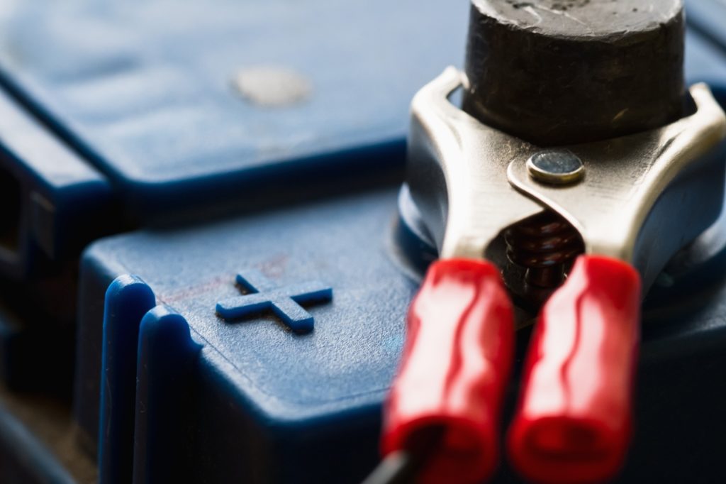 Closeup of car battery's positive terminal