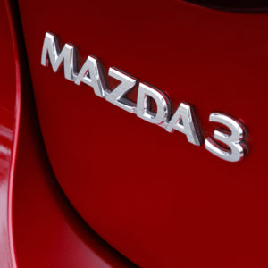 closeup of mazda 3 emblem scaled