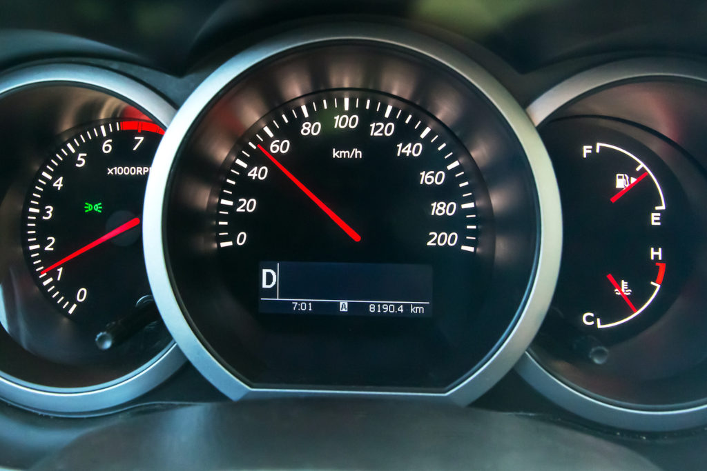 car dash gauge showing acceleration