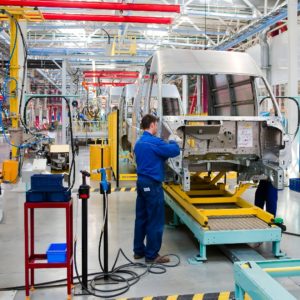 man working in car assembly plant