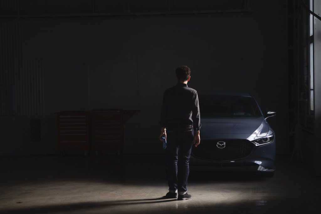 Man standing by 2021 Mazda3 Turbo