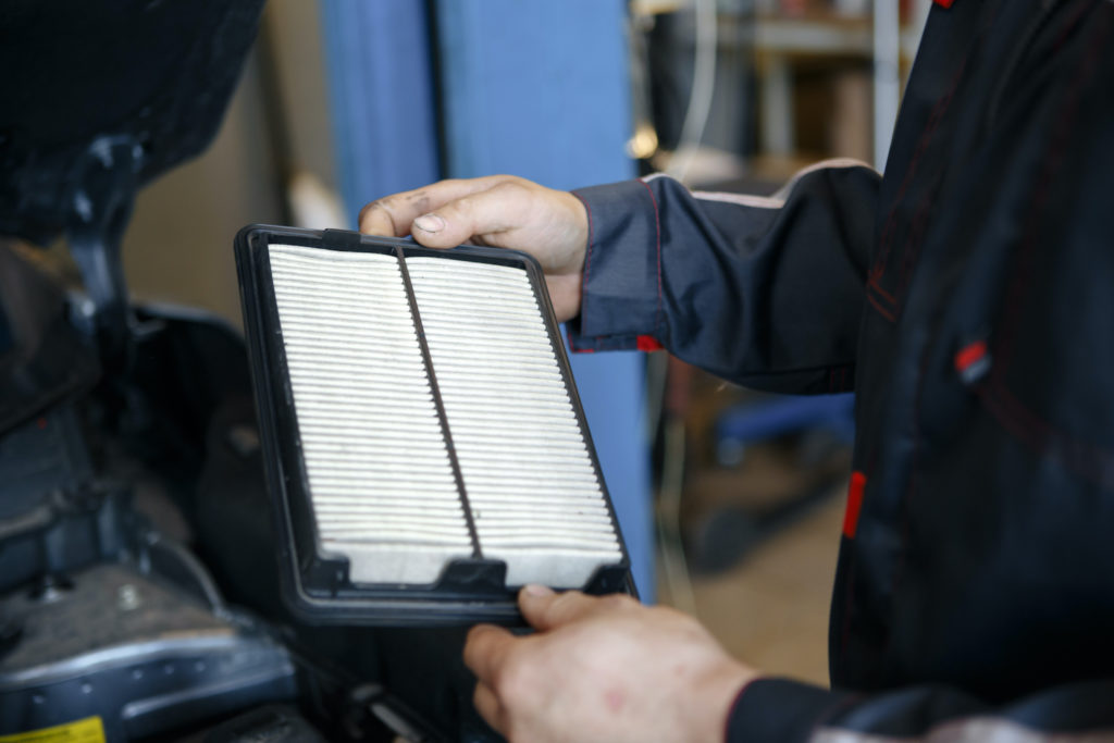 mechanic holding air filter