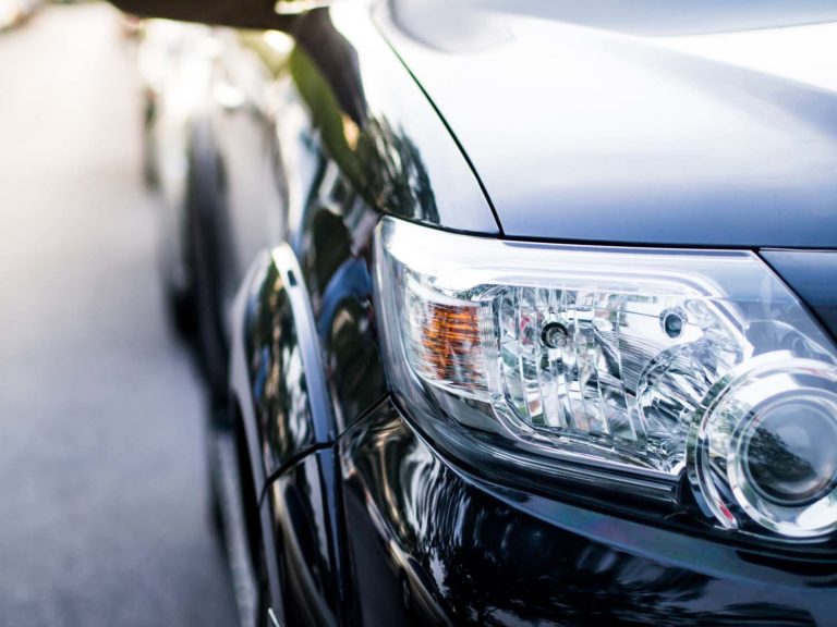 black car headlight close up detail