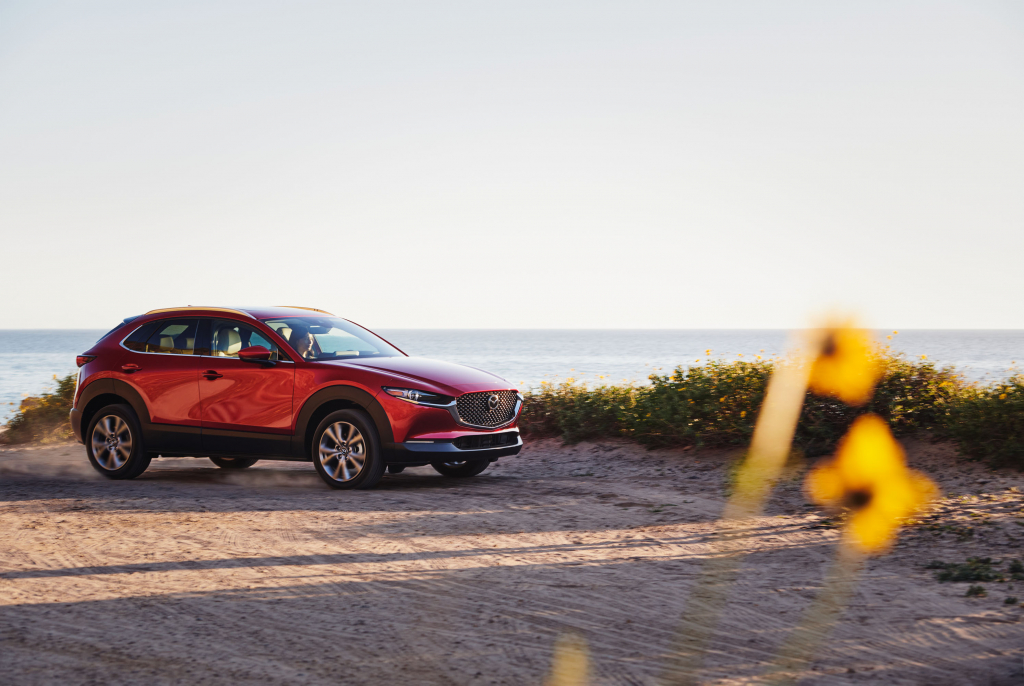 side shot of 2021 mazda cx 30 parked by the ocean