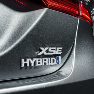 closeup of toyota camry hybrid emblem 1