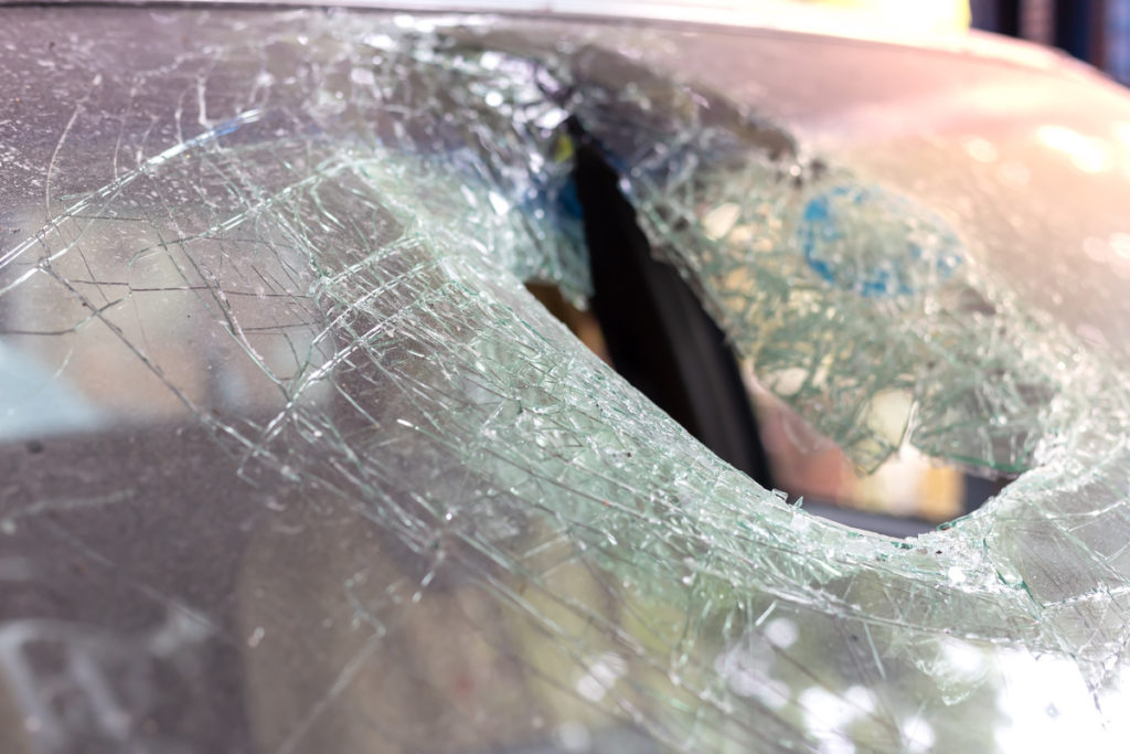 cracked windshield from deer vs. car accident