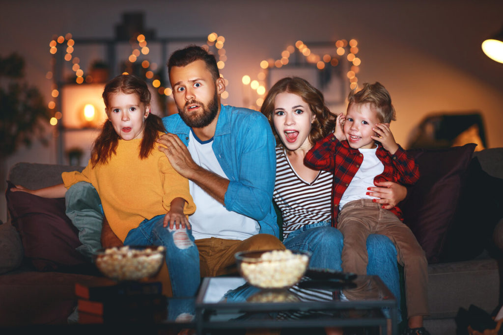 family watching scary movies on halloween 