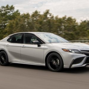 2021 toyota camry hybrid on the road