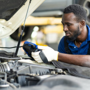 mechanic using an obd scanner