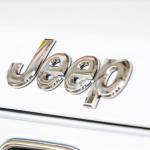 jeep logo on hood of white grand cherokee