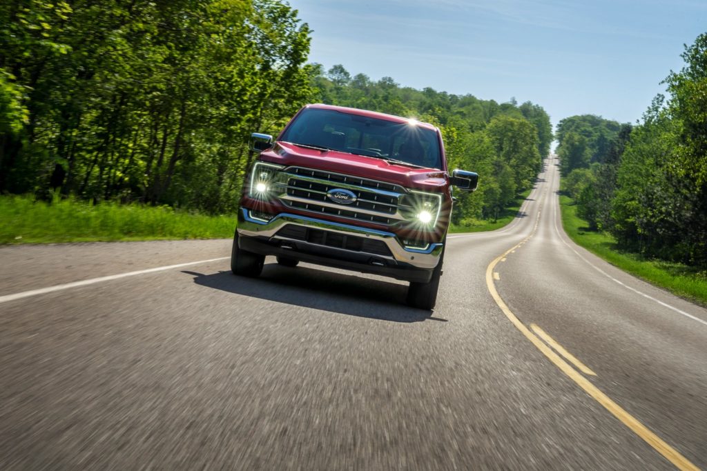 red ford f 150 on the road