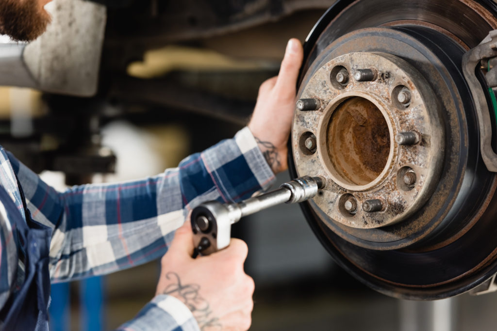 working on a wheel hub with a tool