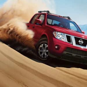 2021 nissan frontier driving down a dune