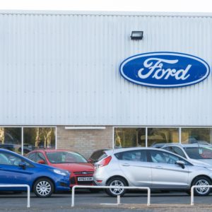 ford cars in front of ford dealership