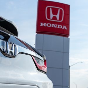 honda car parked outside honda dealership