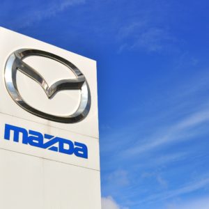 mazda logo against blue sky