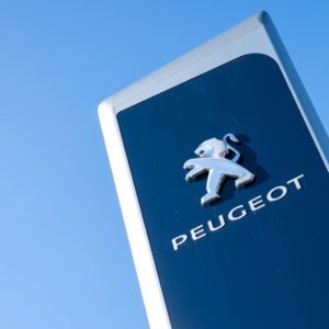 peugeot logo against blue sky