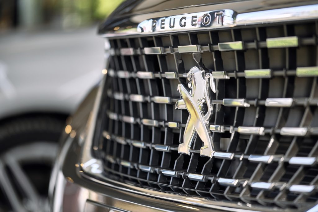 peugeot logo on car grille