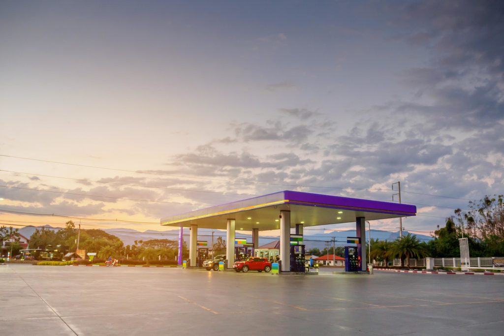 gas station with cloudy sky and sunset