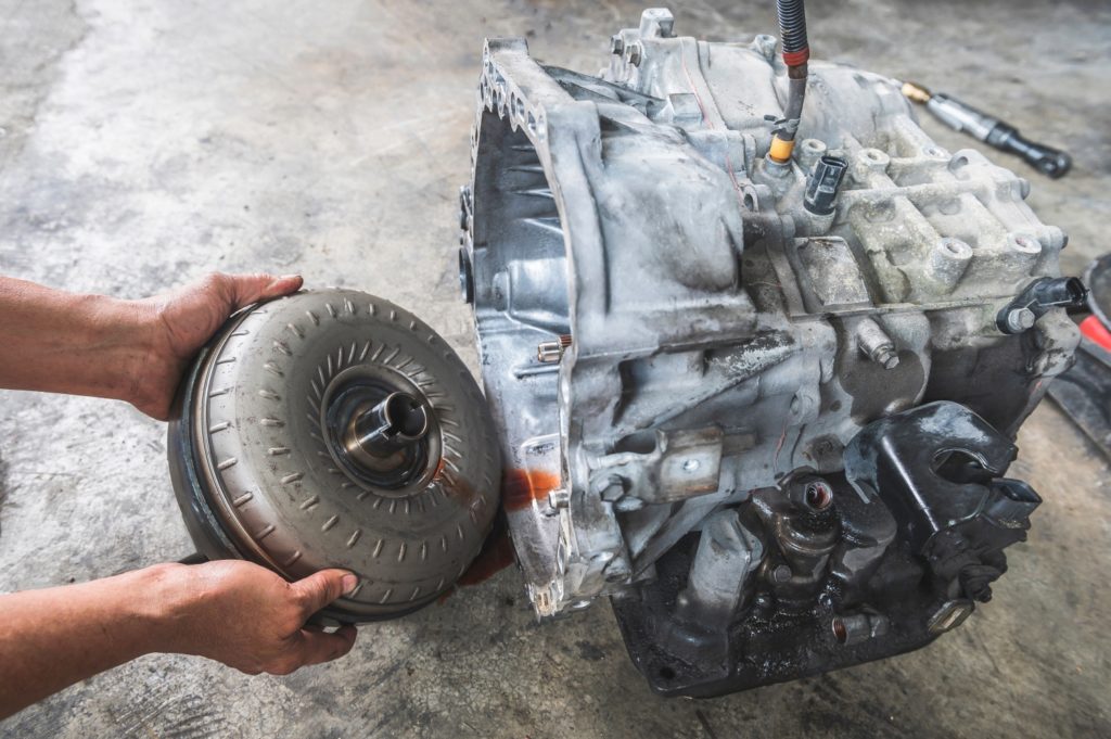 man holding a torque converter