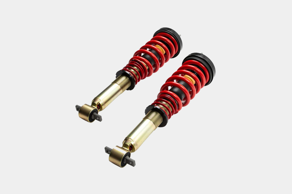 a pair of new car coilovers