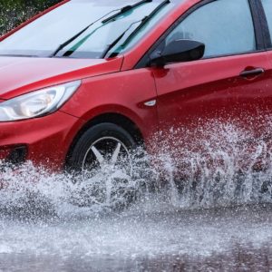 car passing through the flood